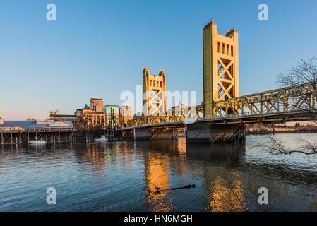 Gold Tower Bridge, in Sacramento California during blue sunset with downtown and goose Stock Photo