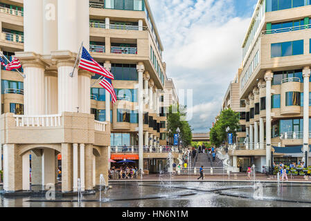 Washington DC, USA - August 5, 2016: Georgetown outdoor mall with restaurants and large fountain on Potomac riverfront with people walking Stock Photo