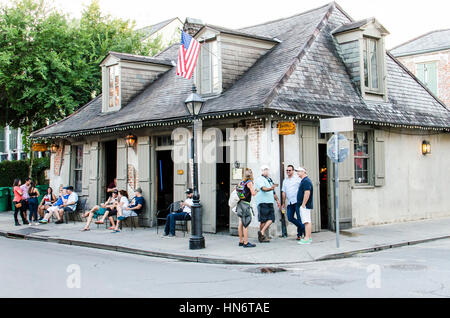 New Orleans, USA - July 8, 2015: People sitting by Lafitte's blacksmith shop bar in French Quarter Louisiana Stock Photo