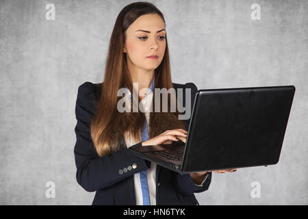 focused business woman working on a laptop Stock Photo