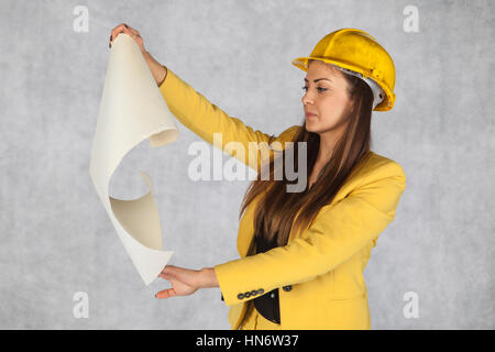 developer is looking at building plans Stock Photo