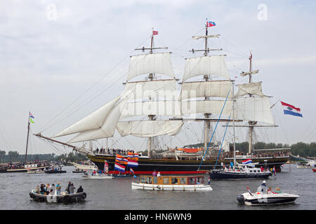 AMSTERDAM, THE NETHERLANDS - AUGUST 19, 2015: Clipper Sail ship 'Stad Amsterdam' in the North Sea Canal enroute to Amsterdam to particiate in the SAIL Stock Photo