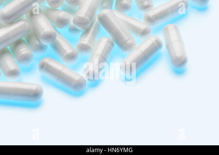 Heap of glowing capsules on white background. Copy space. High resolution product. Health care concept Stock Photo