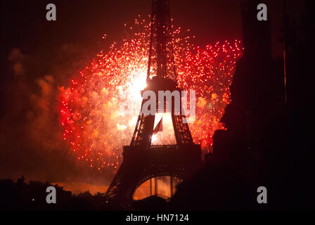 Fireworks behind Eiffel Tower on Bastilia Day in Paris Stock Photo