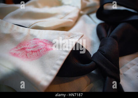 Lipstick stain on the collar of a men's dress shirt. Stock Photo