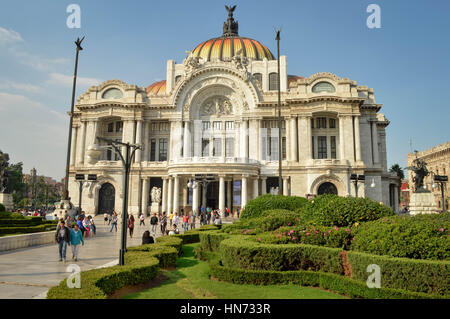 Mexico City, Mexico - November 3, 2014: People spend time in front of the famous Palace of Fine Arts near Alameda Central Park in Mexico city Stock Photo