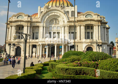 Mexico City, Mexico - November 3, 2014: People spend time in front of the famous Palace of Fine Arts near Alameda Central Park in Mexico city Stock Photo