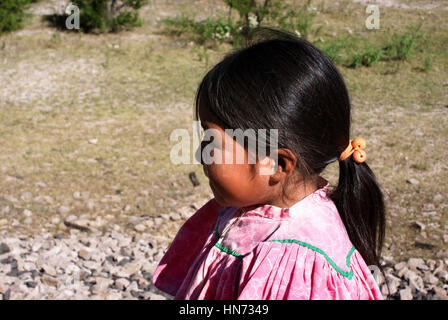 Creel, Mexico - October 9, 2014: Indigenous Tarahumara girl is seen wearing traditional bright outfit in Copper Canyons, Chihuahua, Mexico on October  Stock Photo