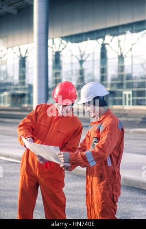 team of young engineers discussing a construction project Stock Photo