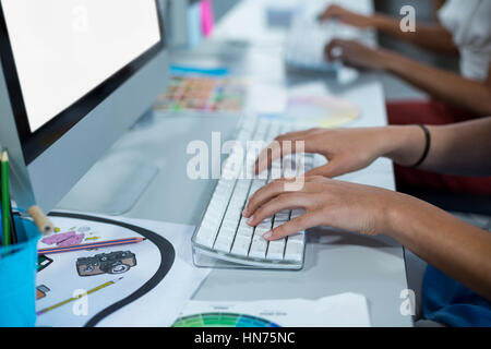 Mid section of female graphic designers working on personal computer in office Stock Photo