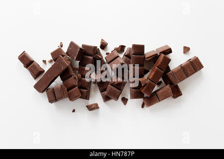 Chunks of Dark Chocolate On White Background. Stock Photo