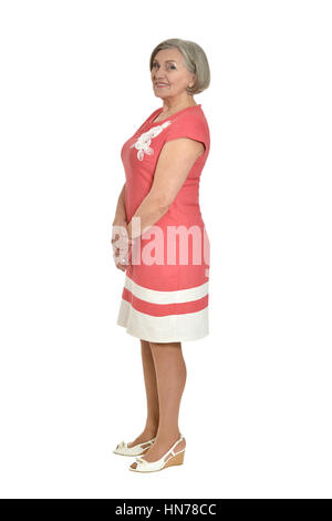 senior woman in coral dress Stock Photo