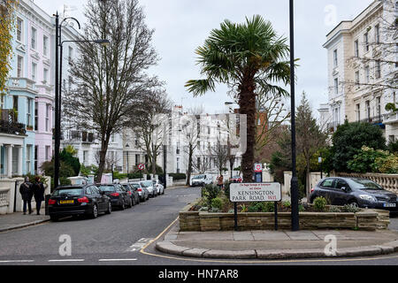 LONDON CITY - DECEMBER 25, 2016: Typical pastel colored houses in Notting hill surrounding a small square with palm trees Stock Photo