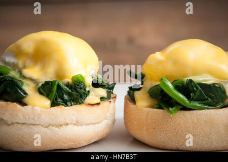 Eggs benedict or eggs florentine on a white plate Stock Photo