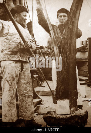 Whaling ship in the Arctic crew stripping the flesh - Victorian period Stock Photo