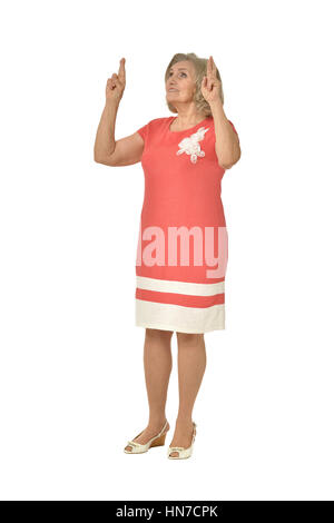 senior woman in coral dress Stock Photo