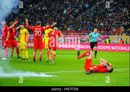 November 12, 2016: An exploding petard next to Robert Lewandowski #9 of Poland National Team during the  World Cup qualifying campaign 2018 game between Romania and Poland at National Arena Stadium, Bucharest,  Romania ROU. Foto: Cristian Stavri/ SportAction.ro |Copyright: CronosFoto/Cristian Stavri| Stock Photo