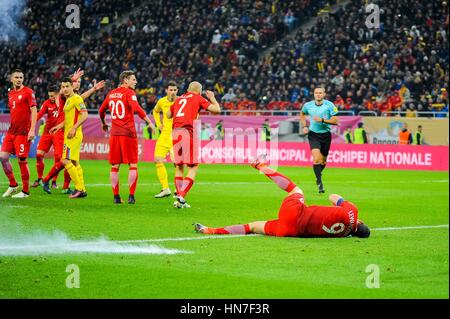 November 12, 2016: An exploding petard next to Robert Lewandowski #9 of Poland National Team during the  World Cup qualifying campaign 2018 game between Romania and Poland at National Arena Stadium, Bucharest,  Romania ROU. Foto: Cristian Stavri/ SportAction.ro |Copyright: CronosFoto/Cristian Stavri| Stock Photo