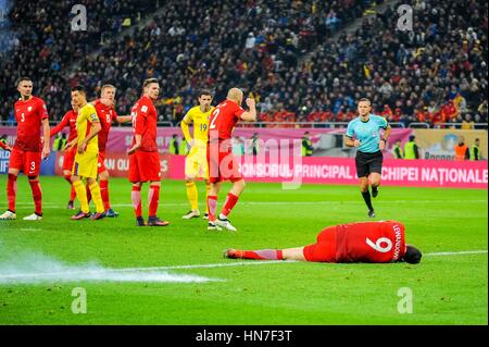 November 12, 2016: An exploding petard next to Robert Lewandowski #9 of Poland National Team during the  World Cup qualifying campaign 2018 game between Romania and Poland at National Arena Stadium, Bucharest,  Romania ROU. Foto: Cristian Stavri/ SportAction.ro |Copyright: CronosFoto/Cristian Stavri| Stock Photo