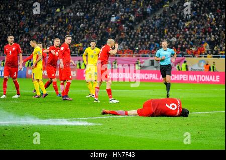 November 12, 2016: An exploding petard next to Robert Lewandowski #9 of Poland National Team during the  World Cup qualifying campaign 2018 game between Romania and Poland at National Arena Stadium, Bucharest,  Romania ROU. Foto: Cristian Stavri/ SportAction.ro |Copyright: CronosFoto/Cristian Stavri| Stock Photo