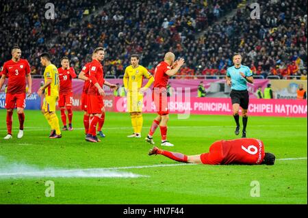 November 12, 2016: An exploding petard next to Robert Lewandowski #9 of Poland National Team during the  World Cup qualifying campaign 2018 game between Romania and Poland at National Arena Stadium, Bucharest,  Romania ROU. Foto: Cristian Stavri/ SportAction.ro |Copyright: CronosFoto/Cristian Stavri| Stock Photo