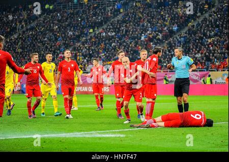 November 12, 2016: Immediately after a petard exploded near Robert Lewandowski #9 of Poland National Team   during the  World Cup qualifying campaign 2018 game between Romania and Poland at National Arena Stadium, Bucharest,  Romania ROU. Foto: Cristian Stavri/ SportAction.ro |Copyright: CronosFoto/Cristian Stavri| Stock Photo