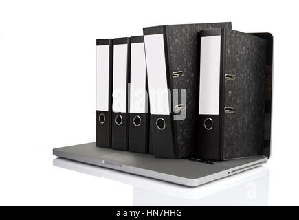 Laptop with some folders getting out the screen isolated on white background Stock Photo