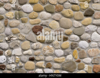 Rock wall of natural river stones Stock Photo