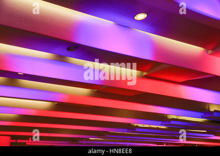 Ceiling illuminated by purple and pink lights Stock Photo