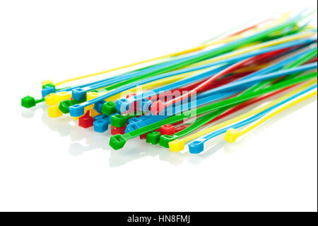 heap of colorful cable ties on white background Stock Photo