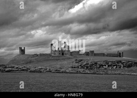 Summer skies, Dunstanburgh Castle, North Northumbrian Coast, Northumbria County, England, UK