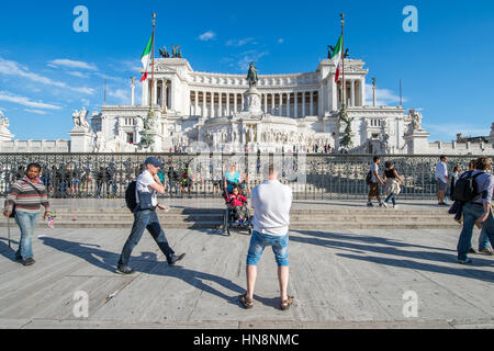 Rome, Italy- Tourists in front of Il Vittoriano monument, otherwise called Altare della Patria (Altar of the Fatherland) in honor of Victor Emmanuel I Stock Photo