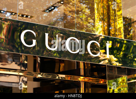 Gucci signage at store entrance. The House of Gucci,is an Italian fashion and leather goods label, part of the Gucci Group, which is owned by PPR Stock Photo