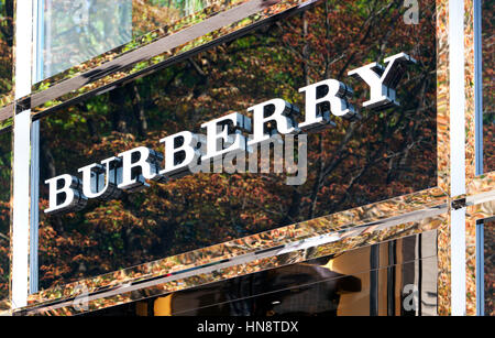 Burberry logo above store entrance on Königsallee. Burberry Group plc is a British luxury fashion house, manufacturing clothing, fragrance and fashion Stock Photo