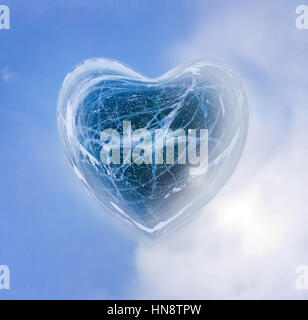 Blue Ice heart with bubbles and cracks isolate. Stock Photo