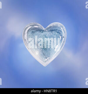 Blue Ice heart with bubbles and cracks isolate. Stock Photo