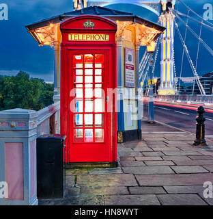 london red telephone box on albert bridge Stock Photo