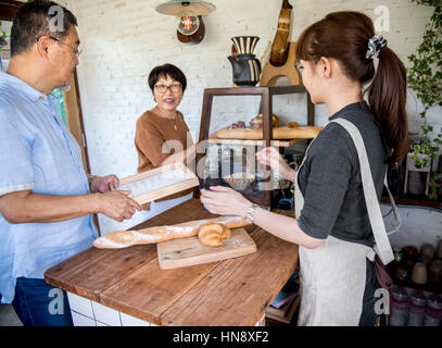 Small bakery business buying customer Stock Photo