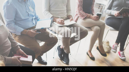 People sitting in a circle counseling Stock Photo