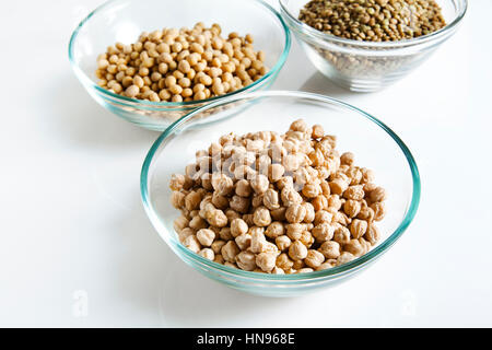 Pile of Chickpeas in bowl and other Legumes on white Stock Photo