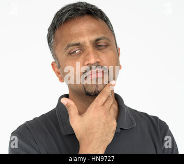 Adult man touching his face thoughtful gesture Stock Photo