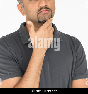Adult man touching his face thoughtful gesture Stock Photo