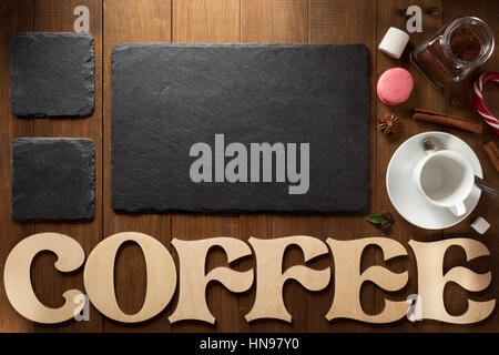 cup of coffee and letters on wooden background Stock Photo
