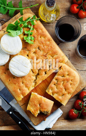 bread snacks on dish on a table with shadows Stock Photo - Alamy