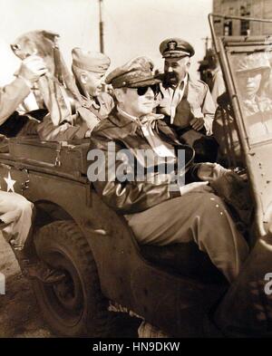 U.S. Gen. Douglas MacArthur, center Vice Admiral Arthur Struble, and Major General Oliver P. Smith use a jeep to make inspection of port facilities during the invasion of Inchon in the Korean War September 16, 1950. Stock Photo