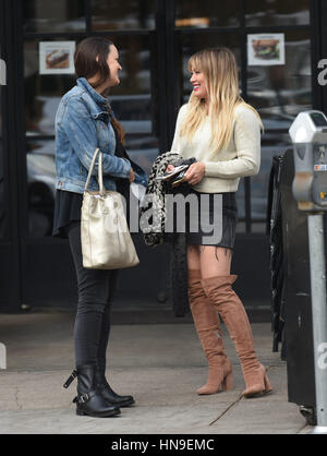 Hilary Duff struts her stuff in a denim skirt and knee high boots while out for lunch with a friend at Joan's on Third in Studio City  Featuring: Hilary Duff Where: Los Angeles, California, United States When: 09 Jan 2017 Credit: WENN.com Stock Photo