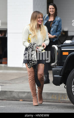 Hilary Duff struts her stuff in a denim skirt and knee high boots while out for lunch with a friend at Joan's on Third in Studio City  Featuring: Hilary Duff Where: Los Angeles, California, United States When: 09 Jan 2017 Credit: WENN.com Stock Photo