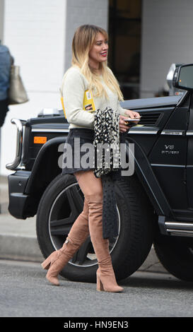 Hilary Duff struts her stuff in a denim skirt and knee high boots while out for lunch with a friend at Joan's on Third in Studio City  Featuring: Hilary Duff Where: Los Angeles, California, United States When: 09 Jan 2017 Credit: WENN.com Stock Photo