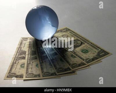 Globe with dollar notes clipping path Stock Photo