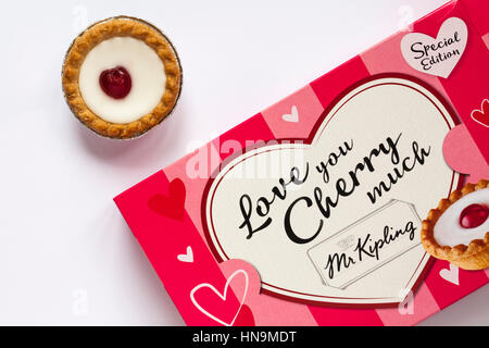 Box of special edition Mr Kipling Love you Cherry Much Bakewell Tarts ready for Valentines day with one tart removed from box set on white background Stock Photo